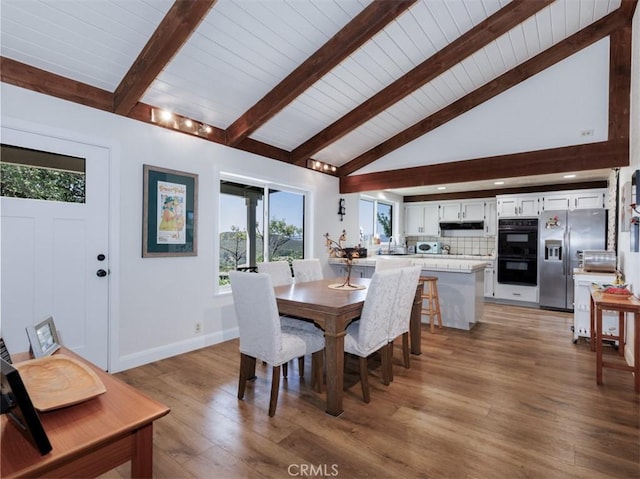 7491 Kingsbury Rd, Templeton, CA 93465 - dining area featuring plenty of natural light, wood finished floors, a wood ceiling with exposed beams, and high vaulted ceiling