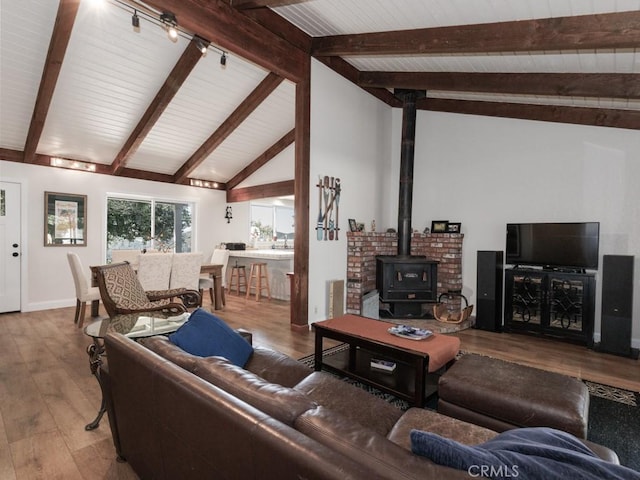 7491 Kingsbury Rd, Templeton, CA 93465 - living room featuring a wood stove and hardwood / wood-style floors