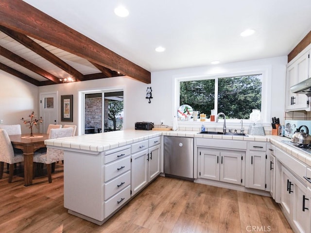 7491 Kingsbury Rd, Templeton, CA 93465 - kitchen featuring dishwasher, a peninsula, tile countertops, light wood-style flooring, and beam ceiling