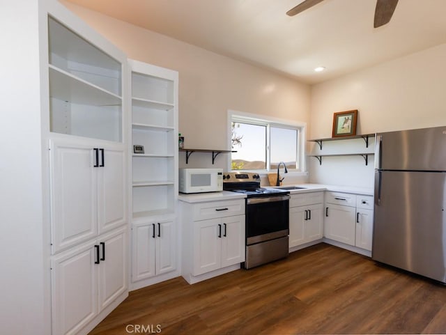 7491 Kingsbury Rd, Templeton, CA 93465 - kitchen with appliances with stainless steel finishes, open shelves, ceiling fan, dark wood finished floors, and white cabinets