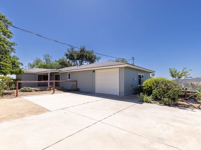 7491 Kingsbury Rd, Templeton, CA 93465 - single story home with concrete driveway, a porch, and a garage