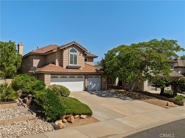 40132 White Leaf Ln, Murrieta, CA 92562 - traditional home featuring a garage, a tiled roof, and driveway