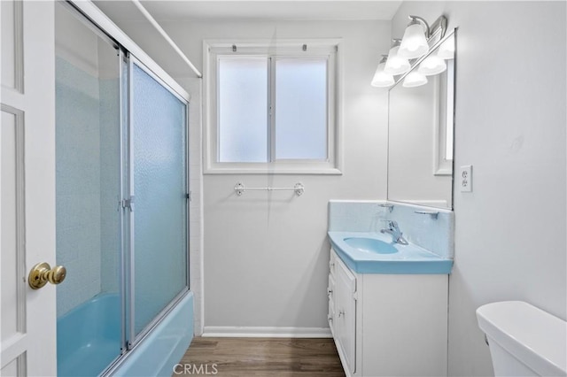 513 W D St, Wilmington, CA 90744 - bathroom with vanity, wood finished floors, and enclosed tub / shower combo