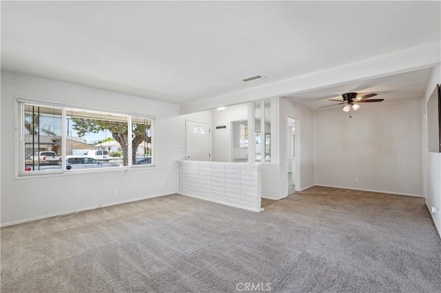 513 W D St, Wilmington, CA 90744 - unfurnished living room featuring carpet floors and a ceiling fan