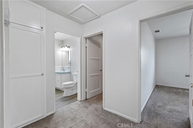 513 W D St, Wilmington, CA 90744 - hall with carpet floors and attic access