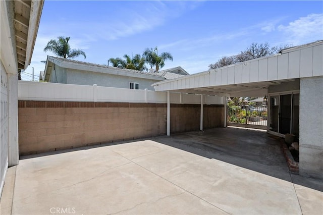 513 W D St, Wilmington, CA 90744 - view of patio / terrace featuring concrete driveway and a carport