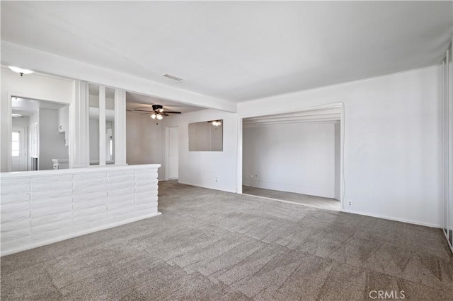 513 W D St, Wilmington, CA 90744 - unfurnished living room featuring carpet and a ceiling fan