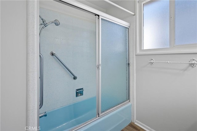 513 W D St, Wilmington, CA 90744 - bathroom featuring enclosed tub / shower combo and wood finished floors