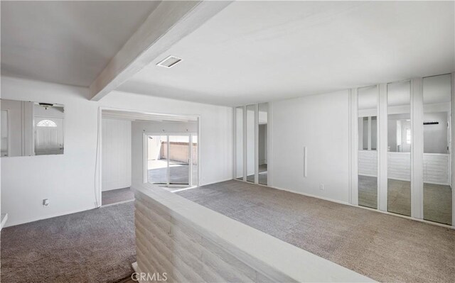 513 W D St, Wilmington, CA 90744 - spare room with carpet floors and beam ceiling