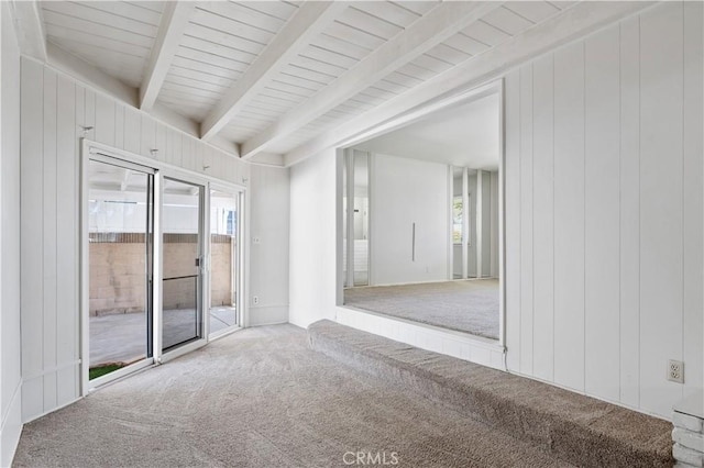 513 W D St, Wilmington, CA 90744 - empty room featuring carpet floors, beam ceiling, and wooden walls