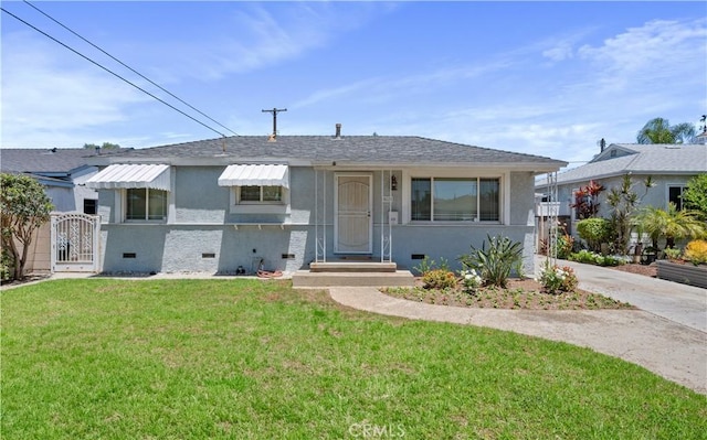 513 W D St, Wilmington, CA 90744 - bungalow with stucco siding, a gate, and a shingled roof