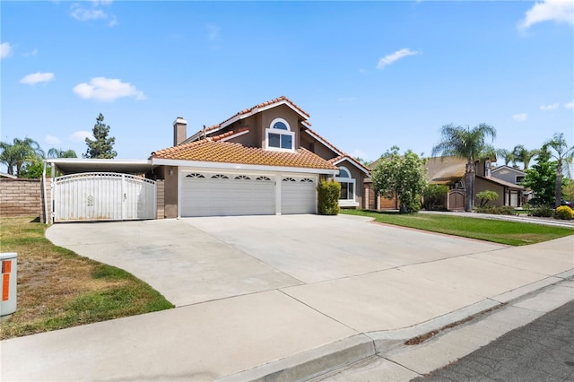 7250 Goldboro Ln, Riverside, CA 92506 - view of front of home with a tiled roof, a gate, driveway, a garage, and stucco siding
