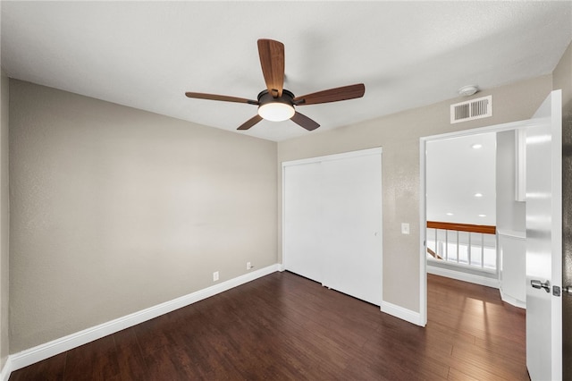 7250 Goldboro Ln, Riverside, CA 92506 - unfurnished bedroom featuring dark wood-style floors, a closet, and ceiling fan