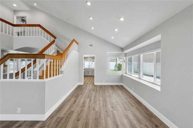 7250 Goldboro Ln, Riverside, CA 92506 - unfurnished living room featuring stairs, wood finished floors, recessed lighting, a ceiling fan, and high vaulted ceiling