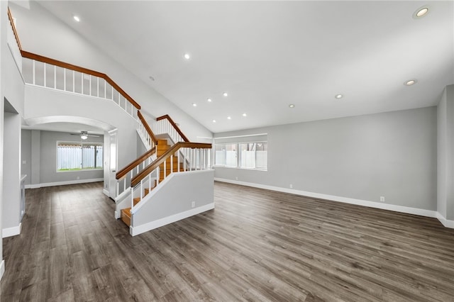 7250 Goldboro Ln, Riverside, CA 92506 - unfurnished living room featuring high vaulted ceiling, stairway, plenty of natural light, wood finished floors, and recessed lighting