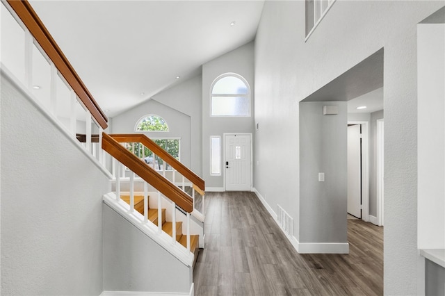 7250 Goldboro Ln, Riverside, CA 92506 - foyer with high vaulted ceiling, wood finished floors, and stairs