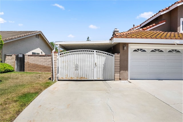 7250 Goldboro Ln, Riverside, CA 92506 - view of front of house featuring concrete driveway, a gate, a tiled roof, and stucco siding