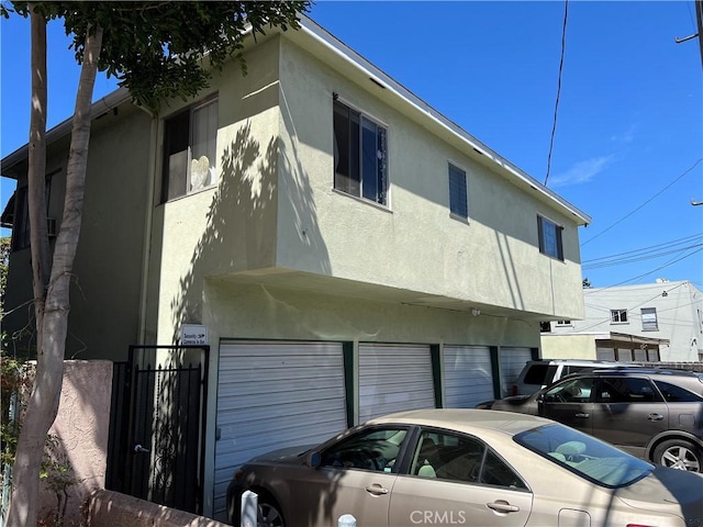 824 Redondo Ave, Long Beach, CA 90804 - view of property exterior featuring stucco siding and a garage