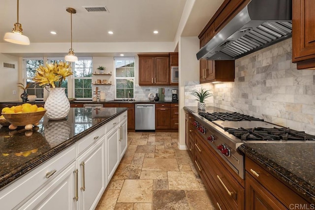 7603 Circulo Sequoia, Carlsbad, CA 92009 - kitchen with extractor fan, appliances with stainless steel finishes, stone tile flooring, tasteful backsplash, and white cabinets