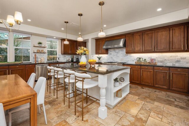 7603 Circulo Sequoia, Carlsbad, CA 92009 - kitchen featuring open shelves, wall chimney exhaust hood, stainless steel dishwasher, stone tile flooring, and recessed lighting