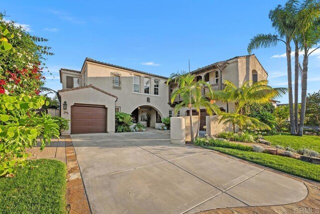 7603 Circulo Sequoia, Carlsbad, CA 92009 - mediterranean / spanish-style home featuring stucco siding, concrete driveway, and an attached garage