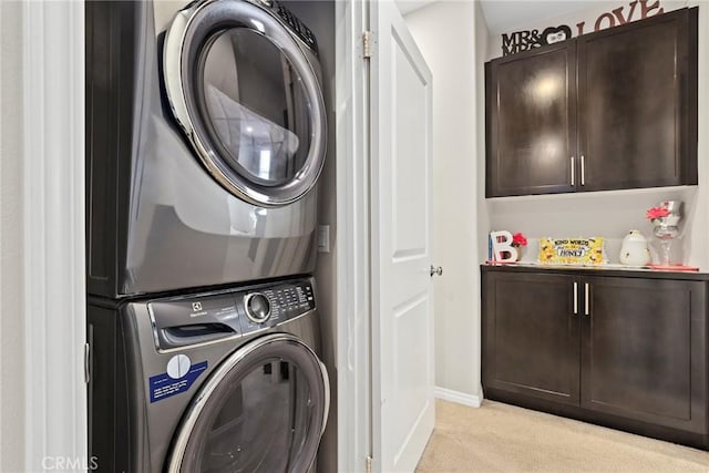 911 Santa Fe Ave Unit A, San Gabriel, CA 91776 - washroom with stacked washing machine and dryer, light carpet, and cabinet space
