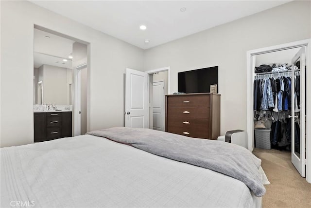 911 Santa Fe Ave Unit A, San Gabriel, CA 91776 - bedroom featuring light carpet, a spacious closet, ensuite bathroom, recessed lighting, and a closet