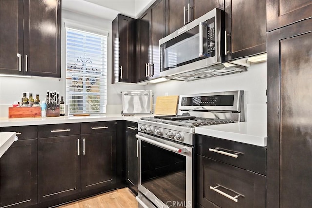 911 Santa Fe Ave Unit A, San Gabriel, CA 91776 - kitchen featuring appliances with stainless steel finishes, light countertops, light wood-style flooring, and dark brown cabinets