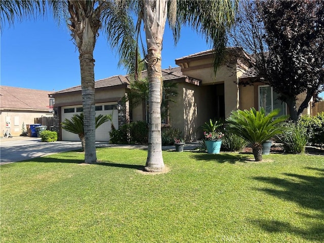 6227 Ocean Jasper Dr, Bakersfield, CA 93313 - view of front of home with stucco siding, an attached garage, concrete driveway, and a front yard