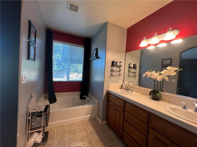 6227 Ocean Jasper Dr, Bakersfield, CA 93313 - full bath featuring double vanity, a garden tub, and tile patterned floors