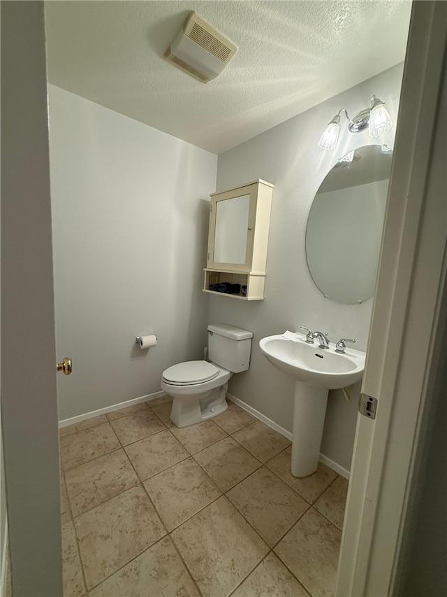 21 Veneto Ln, Aliso Viejo, CA 92656 - half bath with a textured ceiling and tile patterned floors
