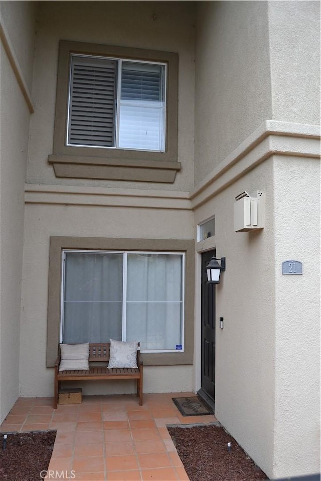21 Veneto Ln, Aliso Viejo, CA 92656 - entrance to property featuring stucco siding and a patio area