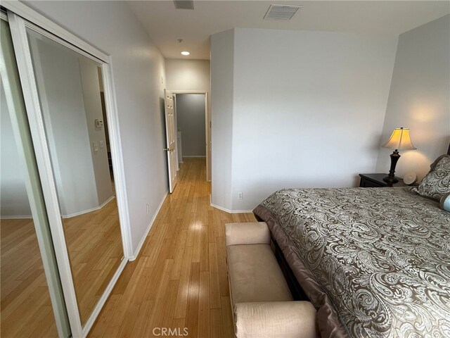 21 Veneto Ln, Aliso Viejo, CA 92656 - bedroom featuring light wood-type flooring, recessed lighting, and a closet