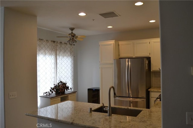 21 Veneto Ln, Aliso Viejo, CA 92656 - kitchen featuring freestanding refrigerator, ceiling fan, light stone countertops, white cabinets, and recessed lighting