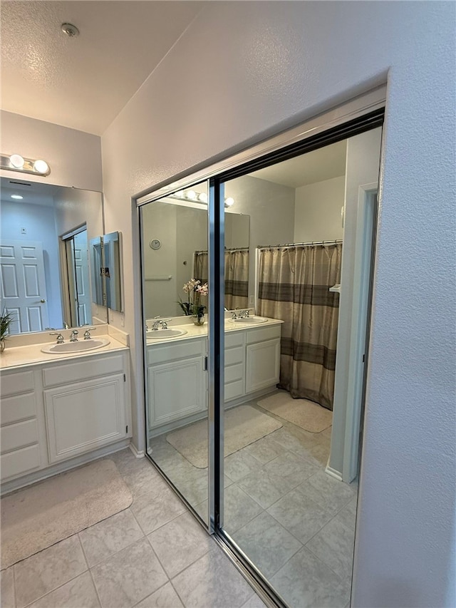 21 Veneto Ln, Aliso Viejo, CA 92656 - bathroom with tile patterned floors and two vanities