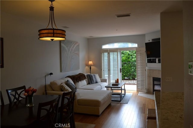 21 Veneto Ln, Aliso Viejo, CA 92656 - living room with wood finished floors and a tiled fireplace