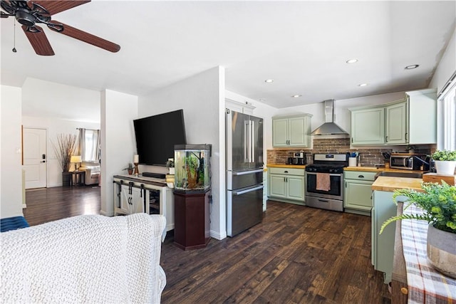 27763 Sequoia Glen Dr, Valencia, CA 91354 - kitchen featuring stainless steel appliances, wall chimney range hood, wooden counters, green cabinetry, and dark wood-type flooring