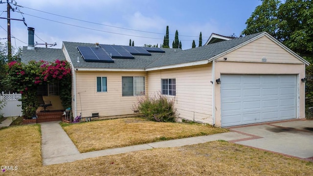 3036 Fairesta St, La Crescenta, CA 91214 - view of front of home with roof mounted solar panels, a front yard, a garage, a shingled roof, and driveway