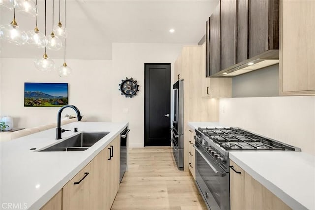 756 W 19th St Unit B, Costa Mesa, CA 92627 - kitchen featuring light brown cabinetry, appliances with stainless steel finishes, light wood-type flooring, light countertops, and recessed lighting