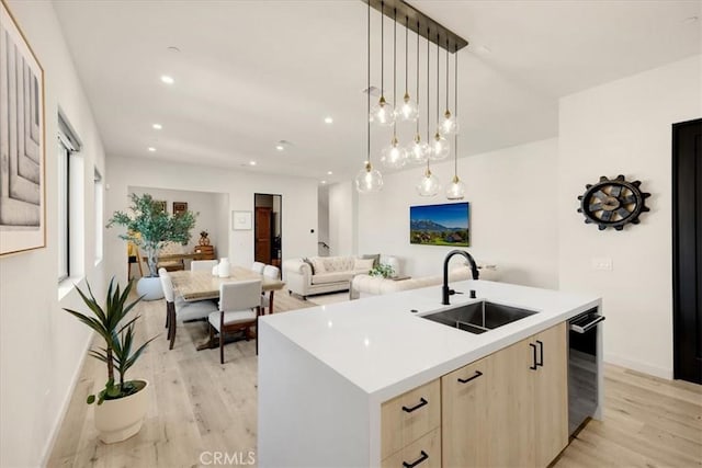 756 W 19th St Unit B, Costa Mesa, CA 92627 - kitchen featuring light brown cabinetry, light wood-style floors, a center island with sink, light countertops, and recessed lighting