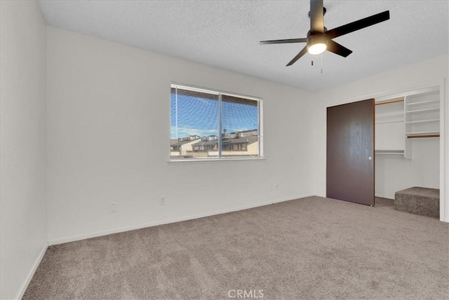 4676 E Alamos Ave Unit 127, Fresno, CA 93726 - unfurnished bedroom with carpet, a closet, a textured ceiling, and a ceiling fan