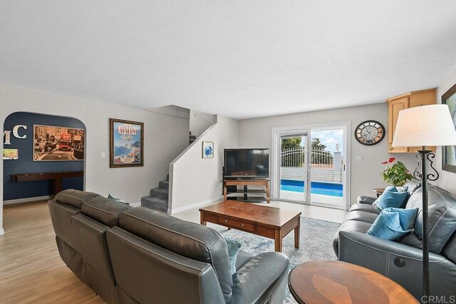 9933 Golden W Ln, Santee, CA 92071 - living room featuring stairs and light wood-style flooring