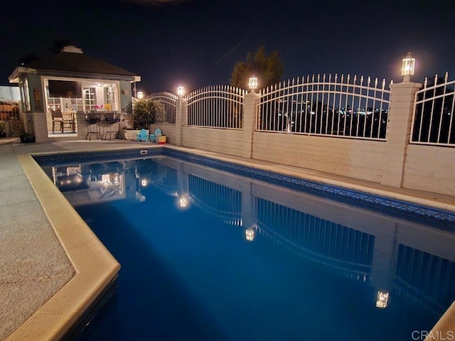 9933 Golden W Ln, Santee, CA 92071 - pool at twilight featuring an outdoor pool and a gazebo