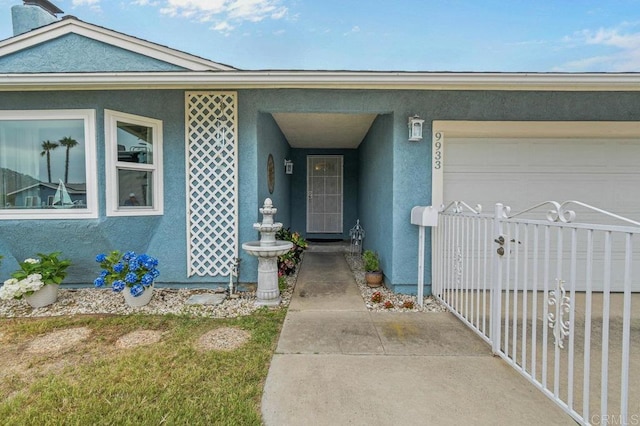 9933 Golden W Ln, Santee, CA 92071 - doorway to property featuring stucco siding and an attached garage