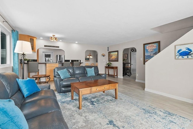 9933 Golden W Ln, Santee, CA 92071 - living room with arched walkways and light wood finished floors