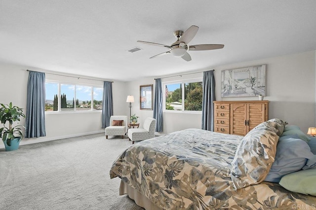 9933 Golden W Ln, Santee, CA 92071 - carpeted bedroom with multiple windows and a ceiling fan
