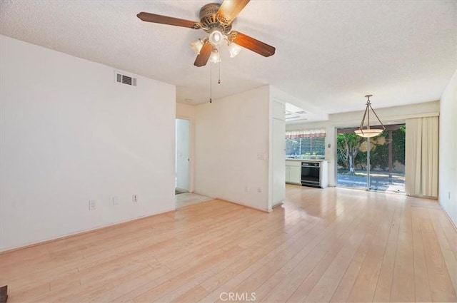 2747 Persimmon Pl, Riverside, CA 92506 - unfurnished room with a textured ceiling, light wood-type flooring, and ceiling fan