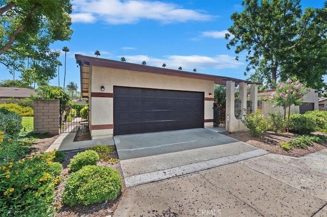 2747 Persimmon Pl, Riverside, CA 92506 - view of front of home featuring stucco siding and a gate