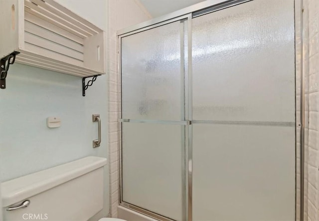 2747 Persimmon Pl, Riverside, CA 92506 - bathroom featuring toilet and a shower with shower door