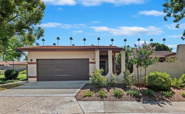 2747 Persimmon Pl, Riverside, CA 92506 - view of front of property with stucco siding, concrete driveway, and an attached garage